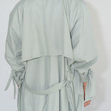 Back detail of ADVA Studios Olive Green Trenchcoat made from organic cotton.