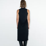 Model in ADVA black turtleneck dress from back.