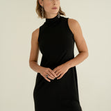 Model in ADVA black turtleneck dress.