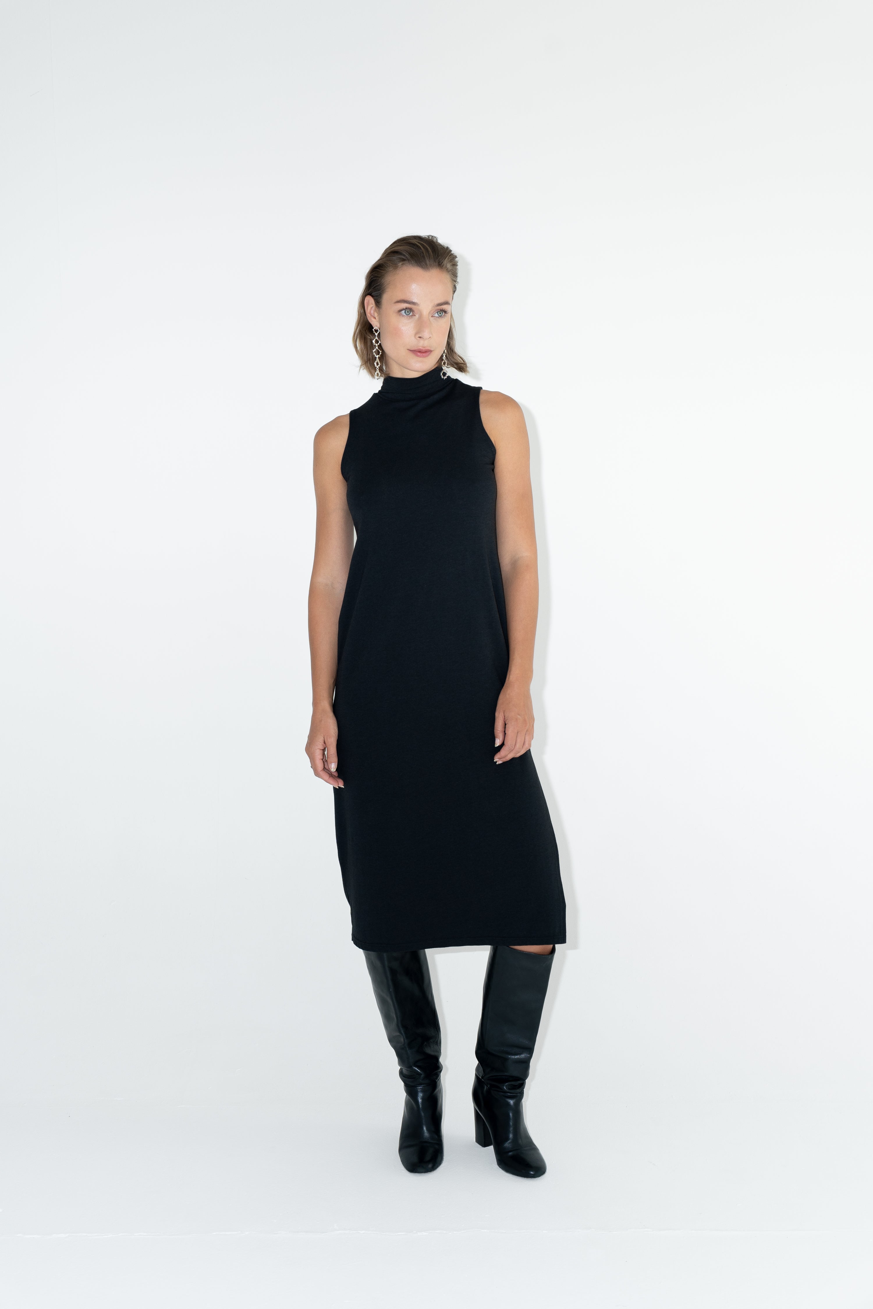 Model in ADVA black turtleneck dress.